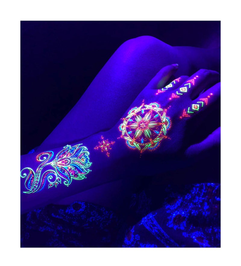 d'IRIS studio Temporary Tattoos for Glow Party UV Blacklight â€“ 1 Sheet Lotus Floral Body Paint Art Light Festival Accessories Glow in the Dark Makeup | 7.2â€ x 5.2â€ Temp Great for EDM EDC Party Rave Parties - Image 1